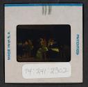 [People seated indoors (travel slide)]