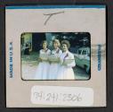 [Three women in white dresses (travel slide)]