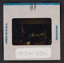 [People seated indoors (travel slide)]
