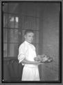 [Boy Holding Plate of Fruit]