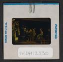 [People seated indoors (travel slide)]