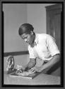 [Young Man Carving]