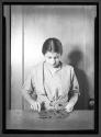 [Woman Printing, Leaf Relief]