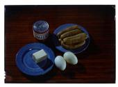 [Sausage, eggs, butter and evaporated milk (advertisement)]