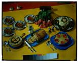 [Dishes of foods on table (advertisement)]