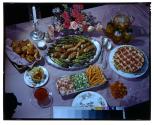 [Dishes of food on table (advertisement)]