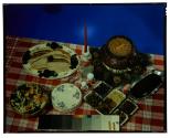[Dishes of food on table (advertisement)]