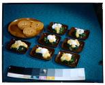 [Dishes of food on table (advertisement)]