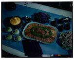 [Dishes of food on table (advertisement)]