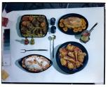 [Dishes of food on table (advertisement)]
