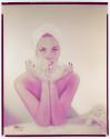 [Woman holding soap bubbles]