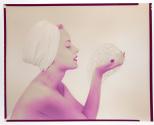 [Woman holding soap bubbles]