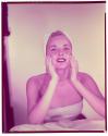 [Woman washing her face]