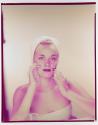 [Woman washing her face]