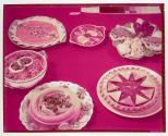 [Dishes of food on red table]