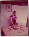 [Woman and bowl of fruit]