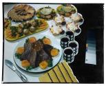 [Dishes of food on table (advertisement)]