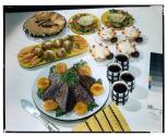 [Dishes of food on table (advertisement)]