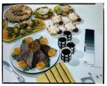 [Dishes of food on table (advertisement)]