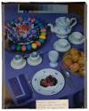 [Painted eggs, tea, and bread on table (advertisement)]