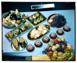 [Dishes of food on table (advertisement)]