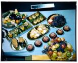 [Dishes of food on table (advertisement)]