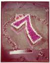 [Flowers arranged in a 7 (advertisement)]