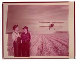 [Biplane and farmers]