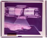 [Machine and hand]