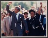 Hand In Hand - Nelson Mandela and wife Winnie, walking hand in hand, punch the air on his release from Victor Verster prison, Cape Town, Sunday. The African National Congress leader had served over 27 years detention.