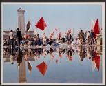 Reflections on Democracy Movement-Morning activity in Beijing's Tiananmen Square is reflected in the wet pavement Wednesday following a downpour Tuesday night. In the background are the Martyrs' yond that Mao's mausoleum.