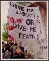 Serious Slogan-One of the additions Tuesday to the many posters up at Beijing University was this slogan from the American Revolution written on a bedsheet.