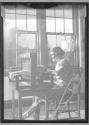 [Woman Weaving On Small Loom]