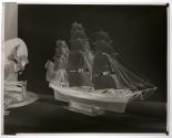 [Model ship and figurine of man riding horse (Hunter)]
