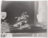 [Figurine of man riding horse and a whiskey bottle (Hunter)]
