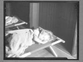 [Two Children on Cots]
