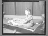 [Boy on Cot]