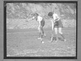 [Women Playing La Crosse]