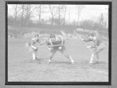 [Three Boys at Football Practice]