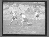 [Women Playing La Crosse]