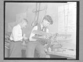 [Two Boys with Model Airplanes]