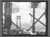 [Empire State Building under construction with New York City skyline]