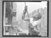 Worker on Girder Pulling Pulley