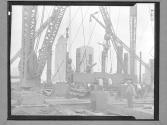 [Lifting a Beam with a Derrick]