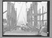[Lifting a Beam with a Derrick]
