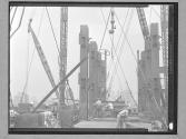 [Lifting a Beam with a Derrick]