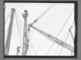 [Two Men on Derrick]