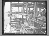 Group of Men on Girders