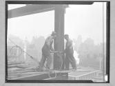 Two Men Riveting a Girder