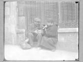 [Couple Eating Lunch on Street Bench]